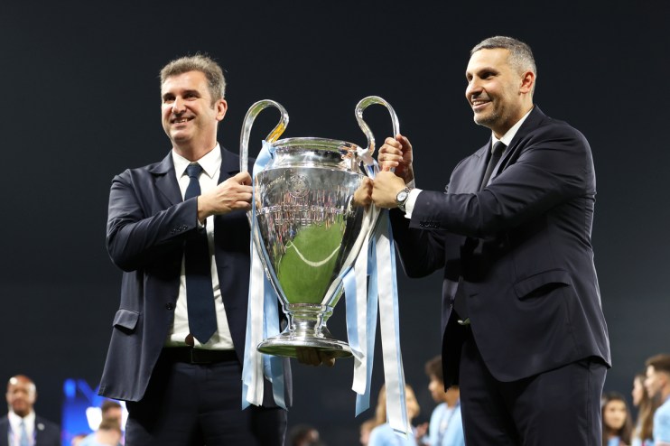 Khaldoon Al Mubarak and Ferran Soriano lift the UEFA Champions League trophy