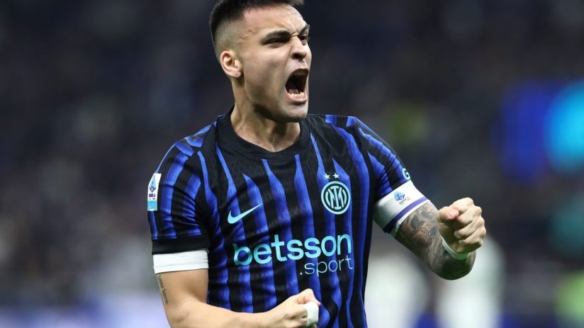 Lautaro Martinez celebrating passionately in his black and blue Inter Milan football jersey