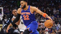 Miles McBride (New York Knicks) dribbling the basketball past an opponent from the San Antonio Spurs during a game