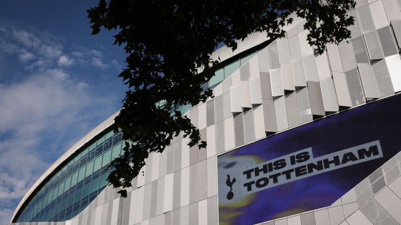 Tottenham Hotspur Stadium exterior with THIS IS TOTTENHAM on a large digital screen