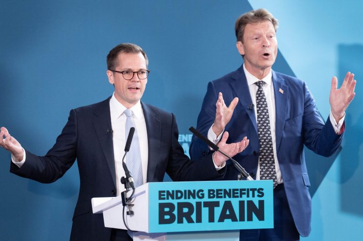 Robert Jenrick and Richard Tice speaking at podiums, blue background, Ending Benefits Britain sign.