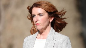 Louise Haigh, a woman with red hair and blue eyes, wearing a grey herringbone jacket.