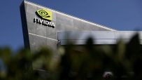 Nvidia logo and name displayed prominently on a modern building facade under a clear blue sky