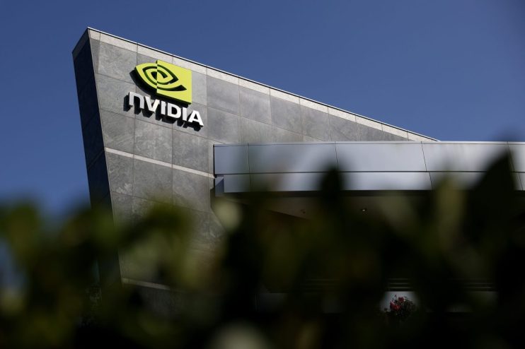 Nvidia logo and name displayed prominently on a modern building facade under a clear blue sky
