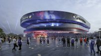 Rendered view of the Philadelphia 76ers arena with fans arriving, showing the modern exterior and vibrant lighting.
