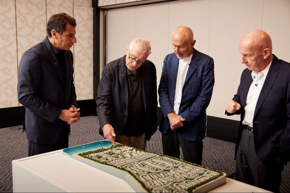 Robert De Niro and partners view a detailed Nobu real estate development model.