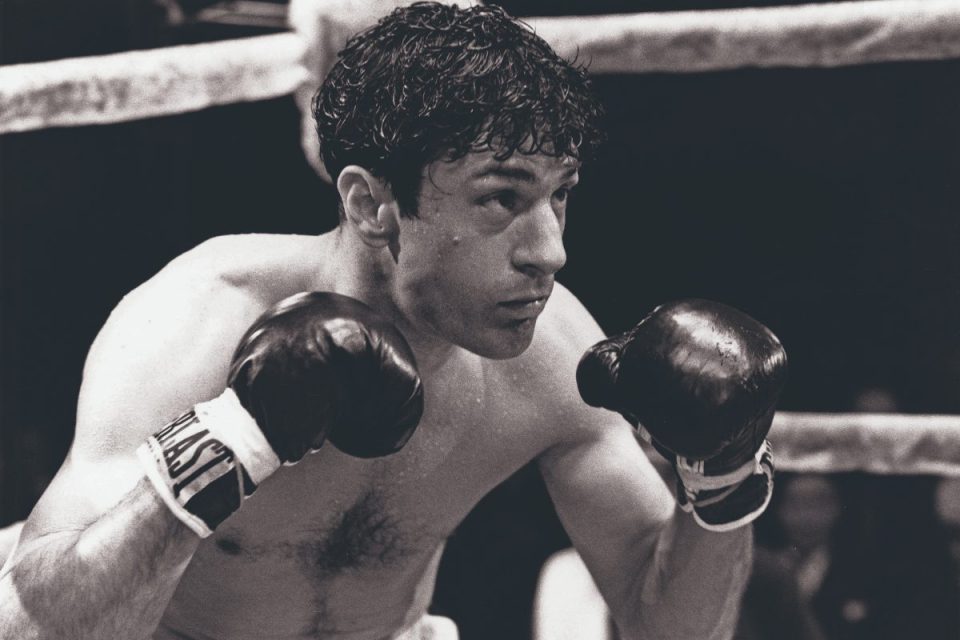 Robert De Niro as Jake LaMotta in Raging Bull, black and white boxing scene with gloves