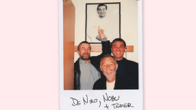 Robert De Niro, Nobu Matsuhisa, and Meir Teper smiling in a Polaroid, with a framed picture in background
