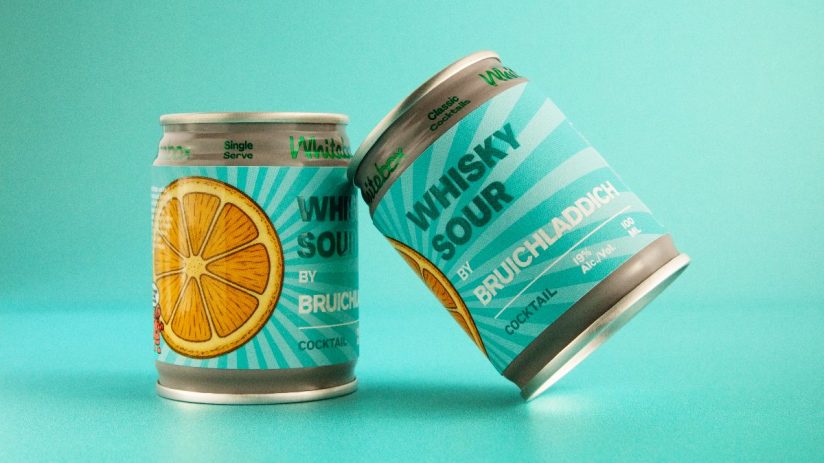 Two Whitebox Whisky Sour by Bruichladdich cocktail cans with orange slice graphics on a teal background.