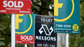 Real estate signs: SOLD (Foxtons) and TO LET (Nelsons, Foxtons), indicating property market activity.