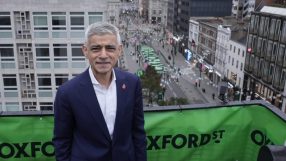 Sadiq Khan overlooking Oxford Street in London, showing the bustling street below and surrounding city buildings.