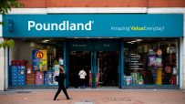 Poundland store exterior with Amazing Value Everyday! sign, featuring entrance, exit, and display windows.