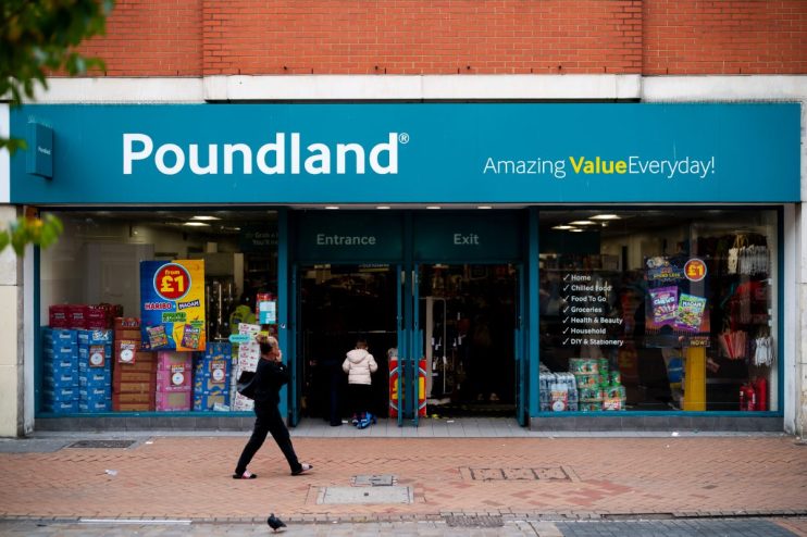 Poundland store exterior with Amazing Value Everyday! sign, featuring entrance, exit, and display windows.