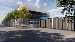 Architectural rendering of a modern AI data centre facility with a security fence, gate, and guardhouse.