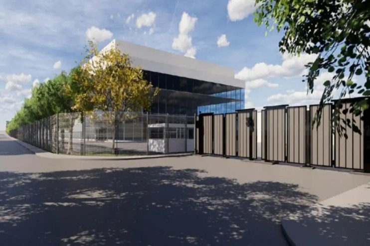 Architectural rendering of a modern AI data centre facility with a security fence, gate, and guardhouse.