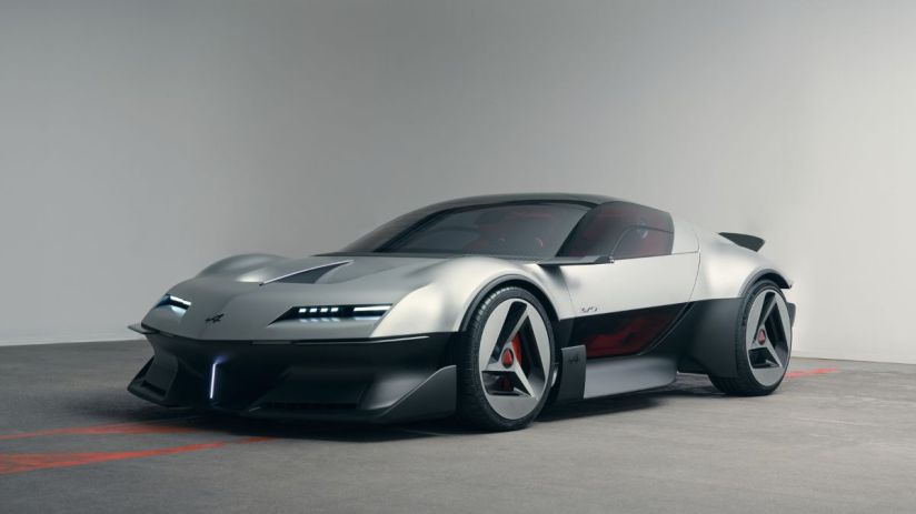 Sleek silver Alpine concept car with black trim, modern LED headlights, and unique wheel design on a concrete floor.