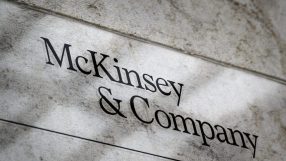 McKinsey & Company sign on a textured wall, representing the global management consulting firm