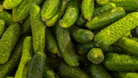 Close-up of a pile of fresh, bumpy green gherkins, possibly related to the Autumn Budget 2026.