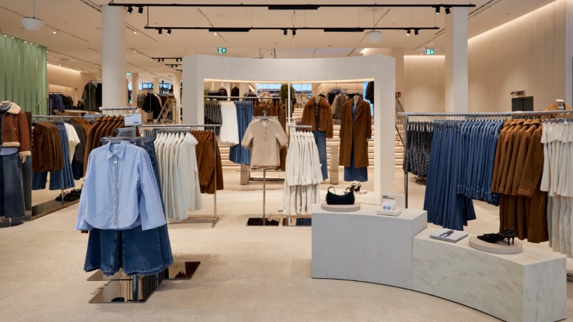 Fashionable shoppers on Drottninggatan in Stockholm, showcasing H&Ms latest trends.