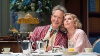 Richard E. Grant and Christine Baranski in Hay Fever, West End play, seated at a breakfast table.