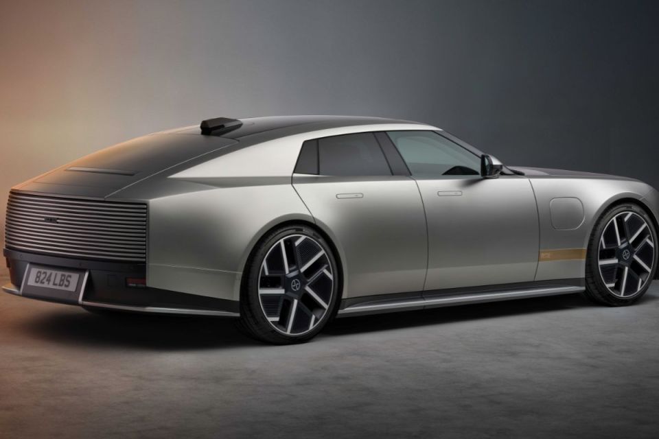 Sleek silver Jaguar electric concept car, rear-side view, showcasing modern design and innovative features