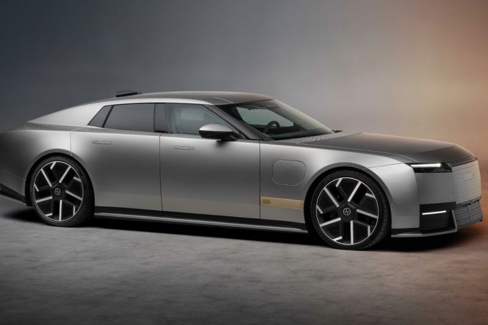 Sleek silver Jaguar electric vehicle concept car with a modern design, dark windows, and multi-spoke wheels