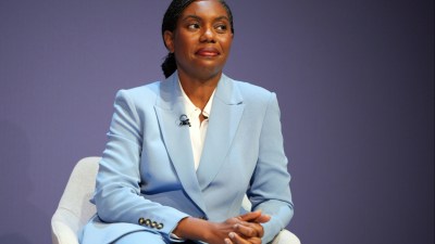 Kemi Badenoch in a light blue suit, seated, speaking at the Conservative Party Conference 2026.