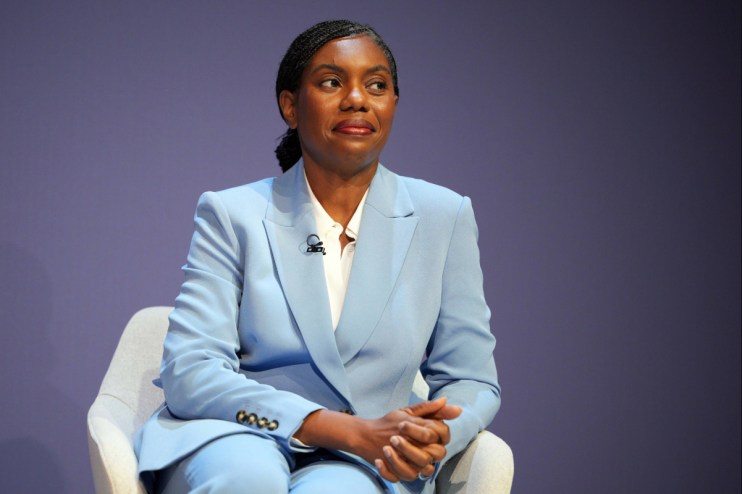 Kemi Badenoch in a light blue suit, seated, speaking at the Conservative Party Conference 2026.
