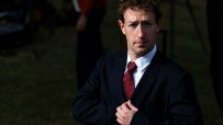 Meta chief executive Mark Zuckerberg in a dark suit and red tie, looking directly at the camera