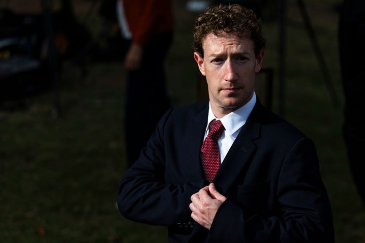 Meta chief executive Mark Zuckerberg in a dark suit and red tie, looking directly at the camera