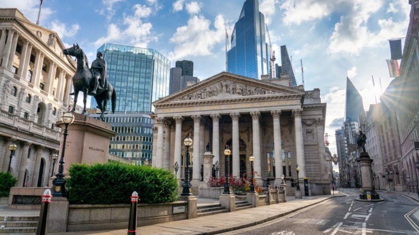 The Royal Exchange and Bank of England building in Londons financial district, with modern skyscrapers behind.