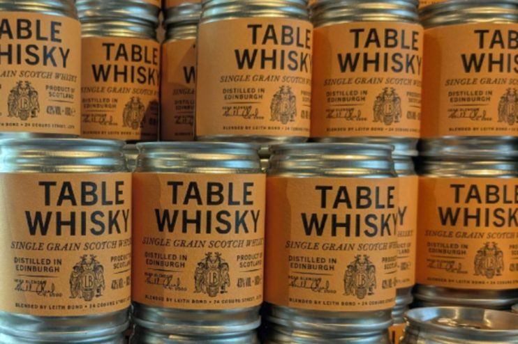 Rows of Table Whisky single grain Scotch jars with orange labels, distilled in Edinburgh.