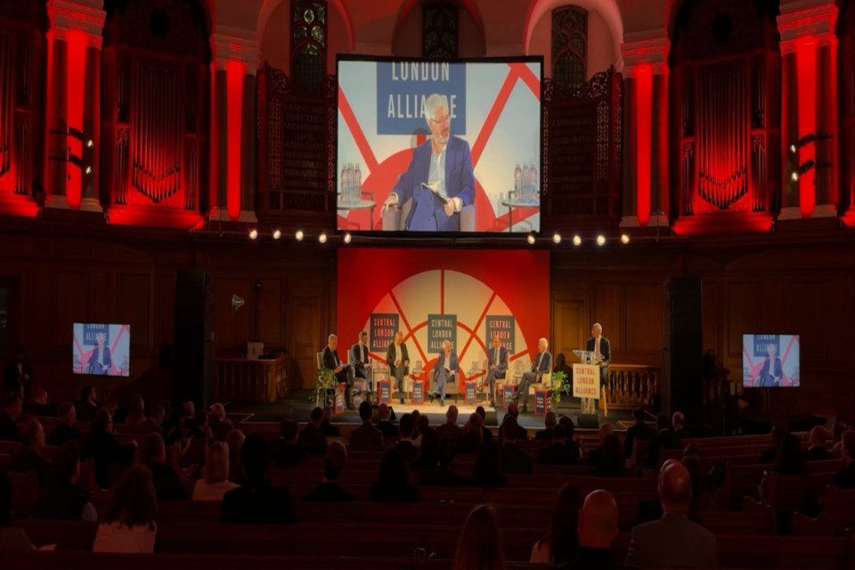 Panel discussion at the Central London Alliance Summit 2025 with speakers on stage and a large screen overhead.