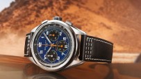 Gallet 1826 chronograph watch with blue dial, orange hands, and black leather strap