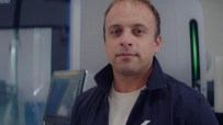 Isembard Alexander Fitzgerald in a navy work jacket, standing in a manufacturing facility