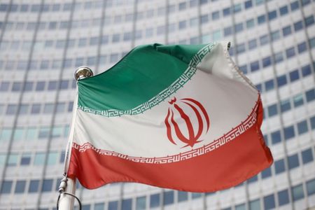 FILE PHOTO: The Iranian flag waves in front of the International Atomic Energy Agency (IAEA) headquarters, before the beginning of a board of governors meeting, amid the coronavirus disease (COVID-19) outbreak in Vienna, Austria, March 1, 2021. REUTERS/Lisi Niesner