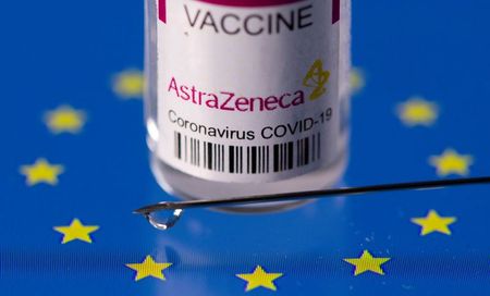 Vial labelled "AstraZeneca coronavirus disease (COVID-19) vaccine" placed