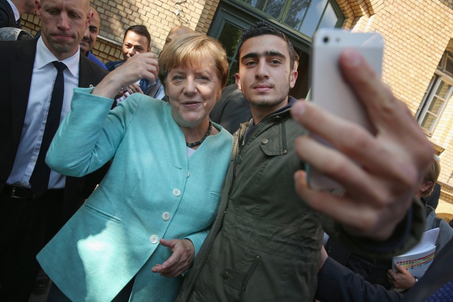 Merkel Visits Migrants' Shelter And School